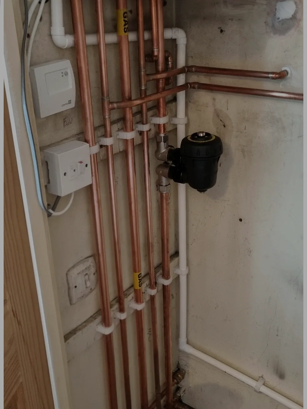 Neat copper pipework and magnetic filter on a Coalville boiler install