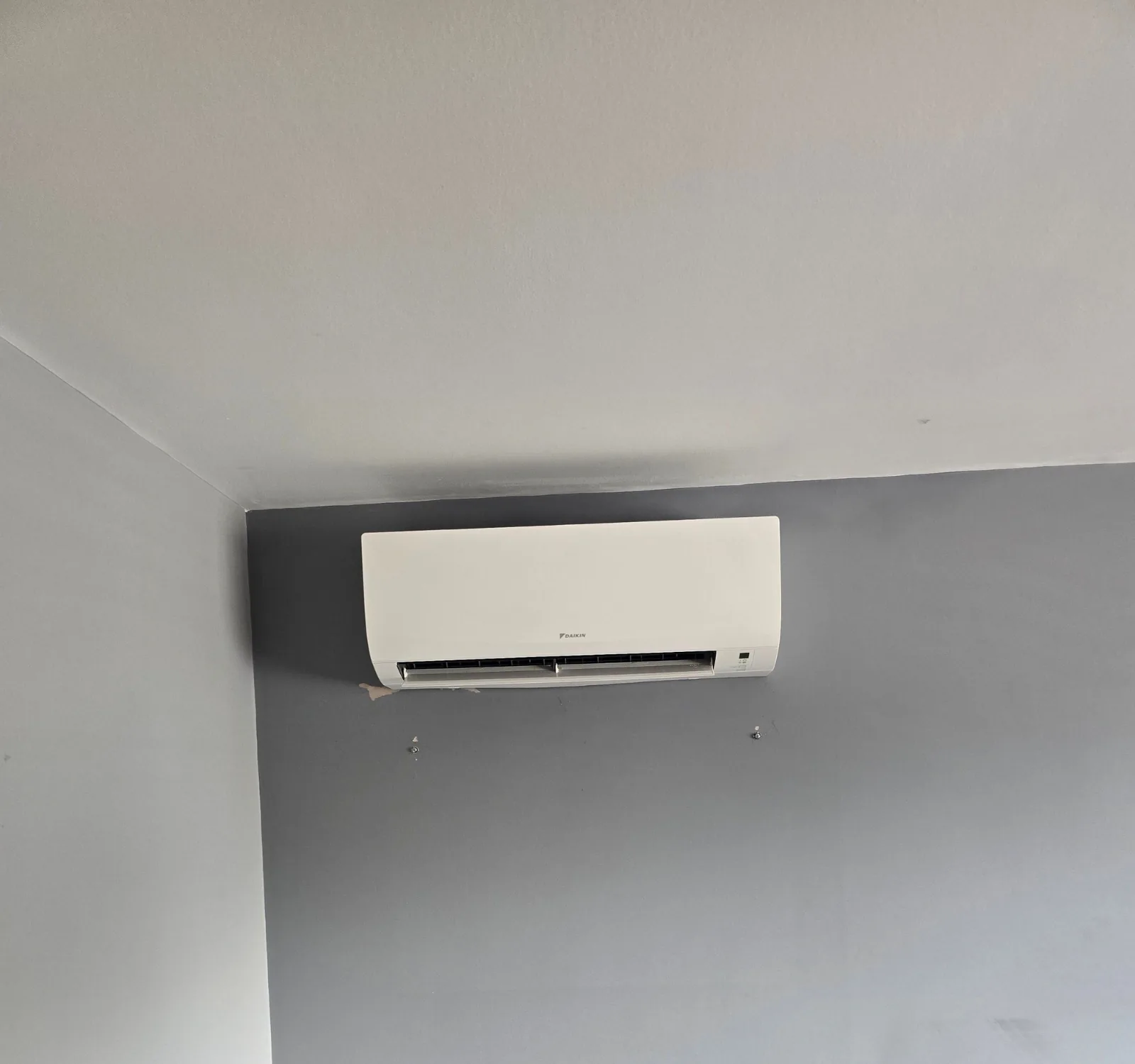 Daikin indoor air conditioning wall unit fitted in a home