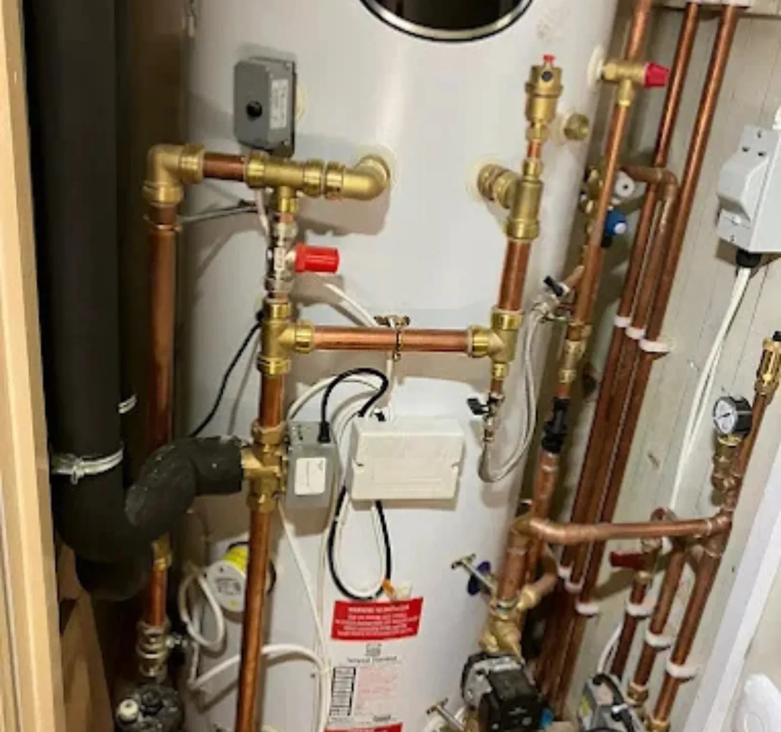 Close-up of cylinder valves and pipework checked during servicing