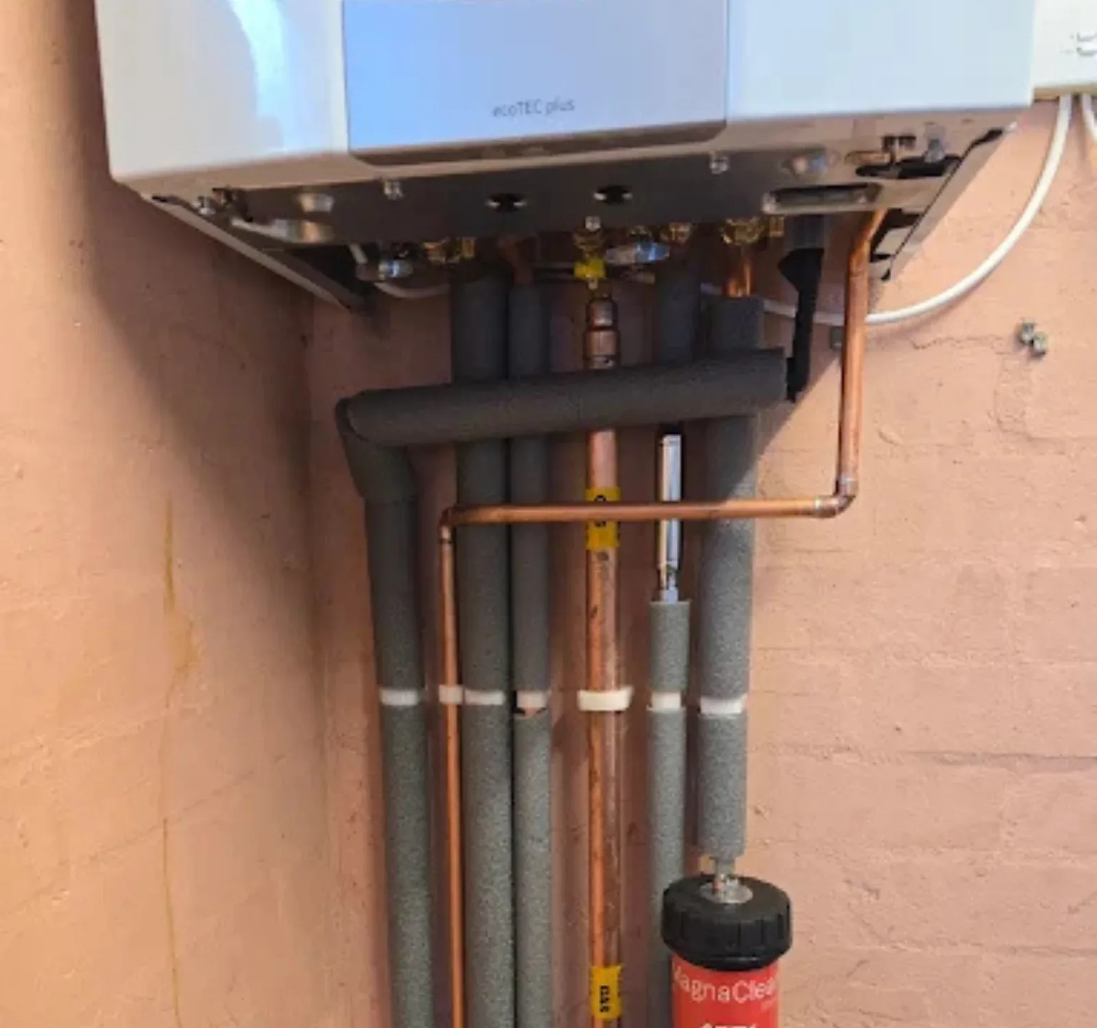 Vaillant gas combi boiler installed by Forge Climate with tidy insulated pipework